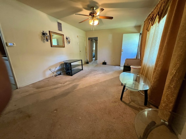 1054 S Hampton Rd, Columbus, OH 43227 - carpeted living room with visible vents and a ceiling fan