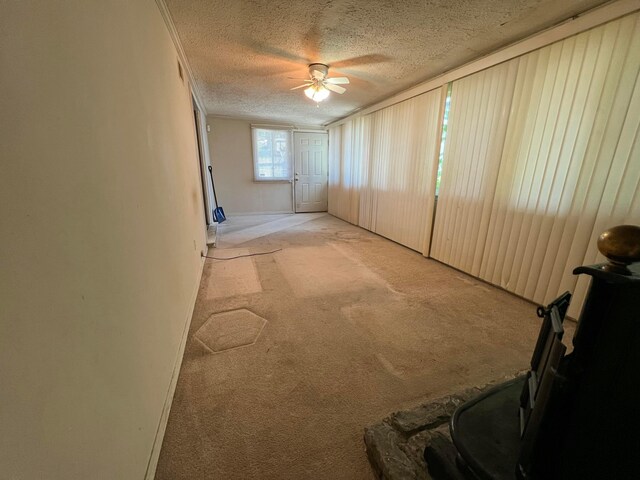 1054 S Hampton Rd, Columbus, OH 43227 - interior space featuring a textured ceiling, light colored carpet, and a ceiling fan