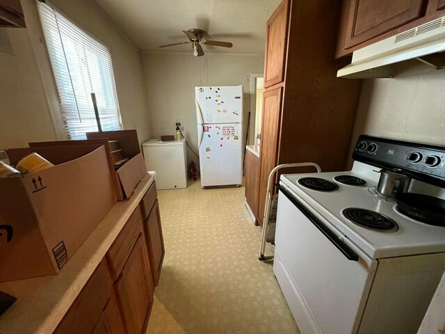 1054 S Hampton Rd, Columbus, OH 43227 - kitchen with ceiling fan, white appliances, light floors, brown cabinetry, and under cabinet range hood