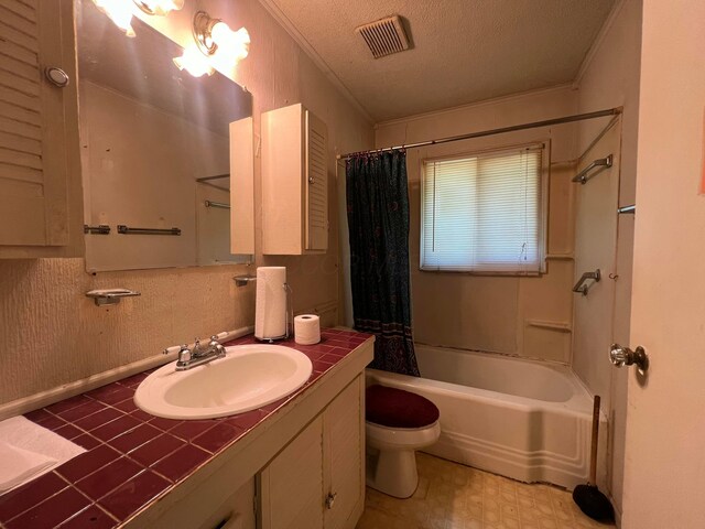 1054 S Hampton Rd, Columbus, OH 43227 - full bath featuring a textured ceiling, vanity, ornamental molding, visible vents, and toilet
