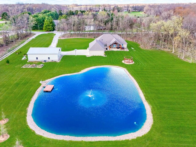 view of pool featuring a water view and fence