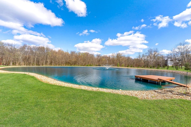 dock area with a water view and a lawn