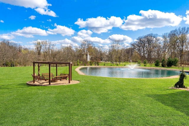 surrounding community with a yard and a water view
