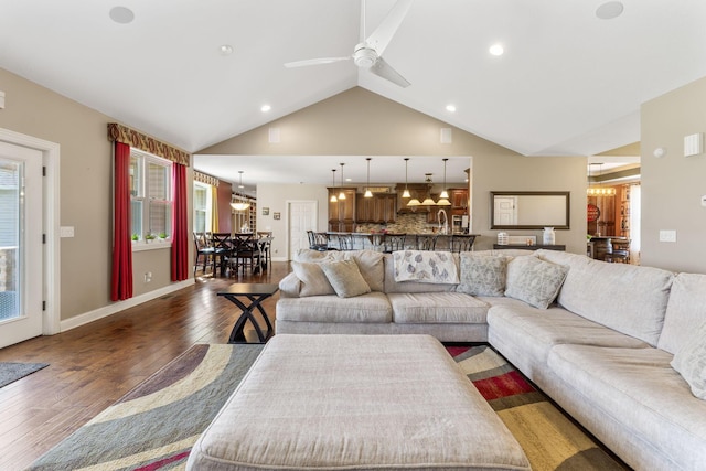 living area featuring hardwood / wood-style floors, high vaulted ceiling, ceiling fan, and recessed lighting