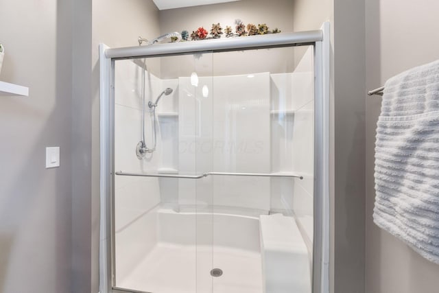 bathroom with a stall shower