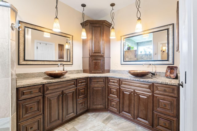 full bath featuring a sink and double vanity