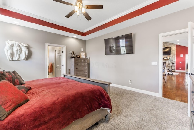 bedroom featuring baseboards, ornamental molding, and carpet