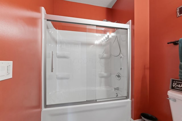 full bathroom with toilet and enclosed tub / shower combo