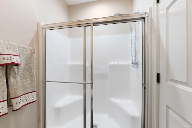 bathroom with a stall shower