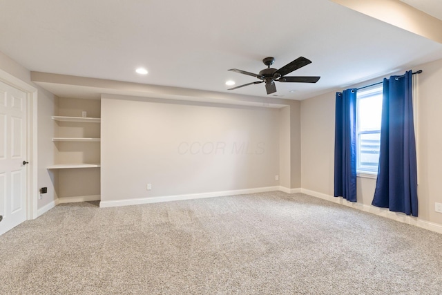 carpeted spare room with recessed lighting, baseboards, and ceiling fan