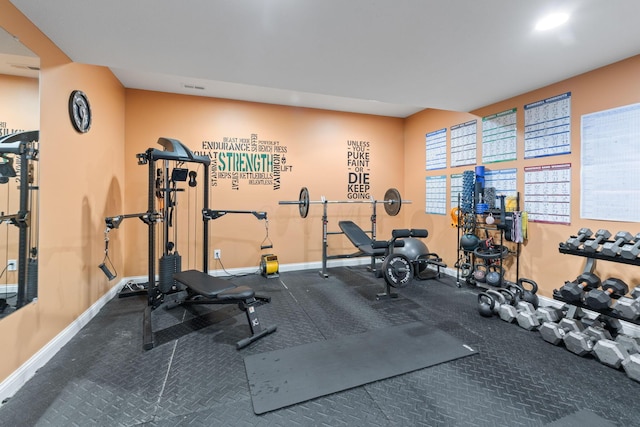 workout area featuring visible vents and baseboards