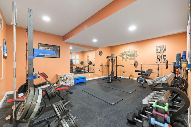 workout area with baseboards and recessed lighting