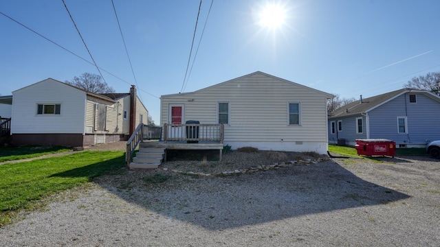 back of house featuring crawl space