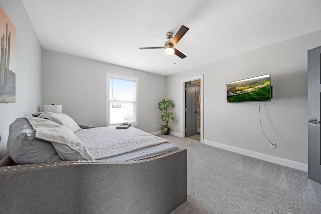 carpeted bedroom featuring a ceiling fan and baseboards
