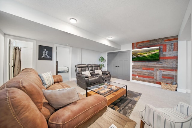 living room featuring carpet floors and a textured ceiling