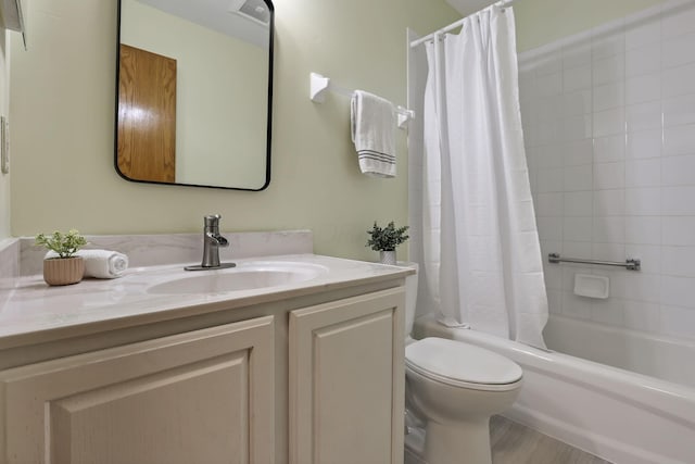 full bath with vanity, shower / bath combination with curtain, visible vents, and toilet