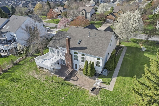 birds eye view of property with a residential view