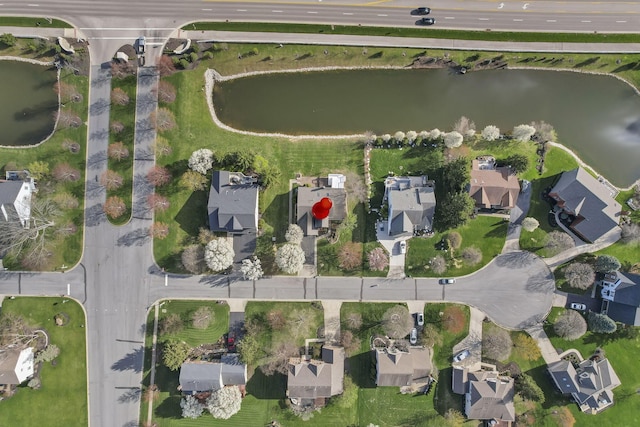 birds eye view of property featuring a residential view and a water view