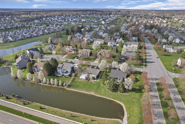 aerial view with a water view and a residential view