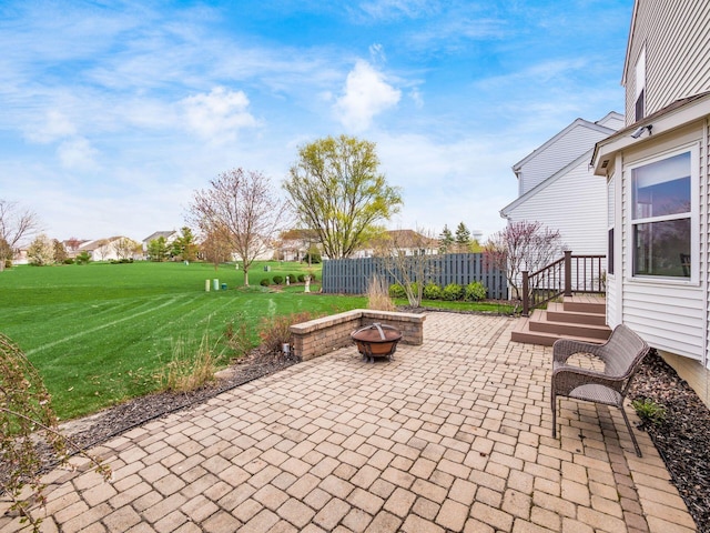 view of patio with a fire pit