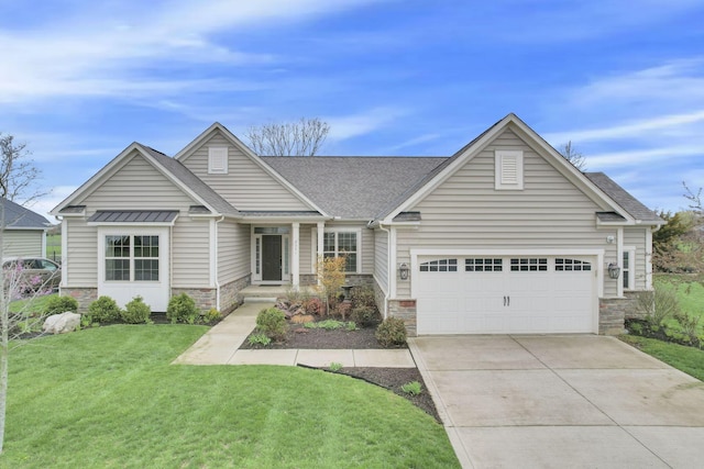5351 Lilac Ave, Grove City, OH 43123 - view of front of home with stone siding, concrete driveway, a front yard, a garage, and roof with shingles
