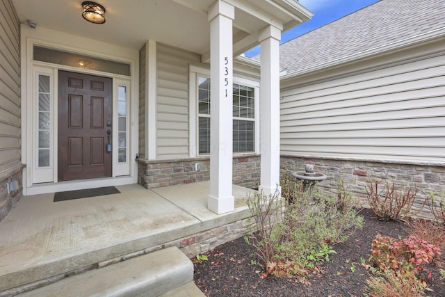5351 Lilac Ave, Grove City, OH 43123 - doorway to property with covered porch and roof with shingles