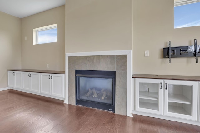 5351 Lilac Ave, Grove City, OH 43123 - unfurnished living room with wood finished floors and a fireplace