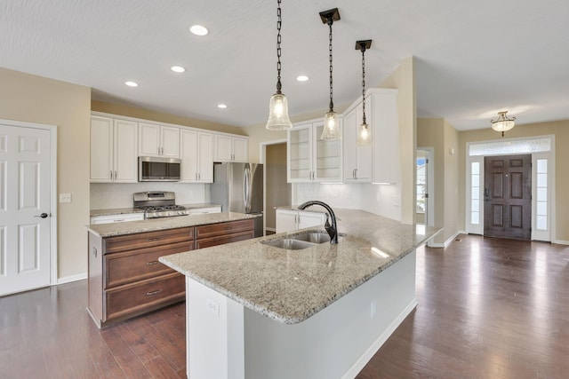5351 Lilac Ave, Grove City, OH 43123 - kitchen featuring appliances with stainless steel finishes, glass insert cabinets, dark wood-style floors, white cabinetry, and recessed lighting