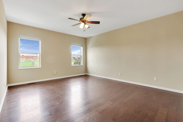5351 Lilac Ave, Grove City, OH 43123 - empty room with a ceiling fan and dark wood-style flooring