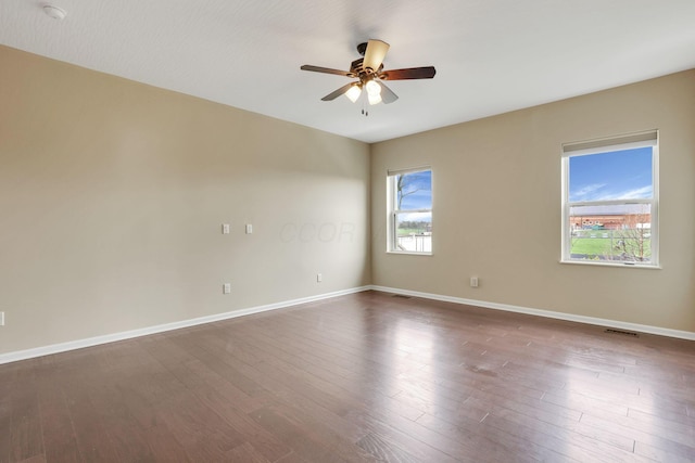 5351 Lilac Ave, Grove City, OH 43123 - spare room featuring a ceiling fan, dark wood finished floors, and a smoke detector