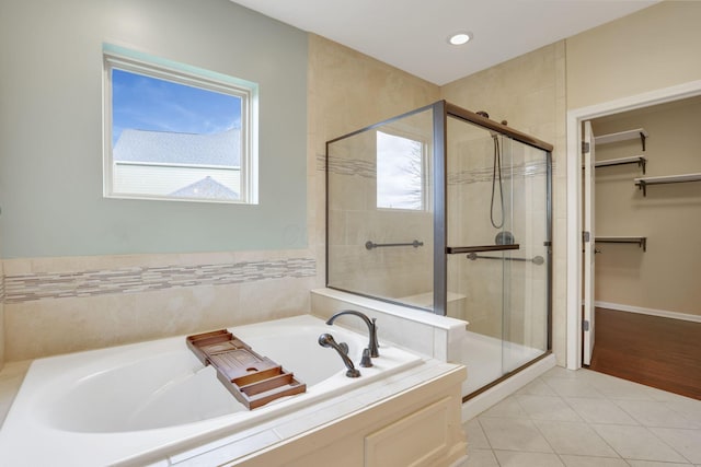 5351 Lilac Ave, Grove City, OH 43123 - full bath featuring a garden tub, a shower stall, a spacious closet, tile patterned floors, and recessed lighting
