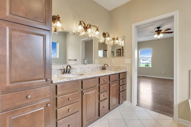 5351 Lilac Ave, Grove City, OH 43123 - full bath featuring double vanity, tile patterned flooring, a ceiling fan, and a chandelier