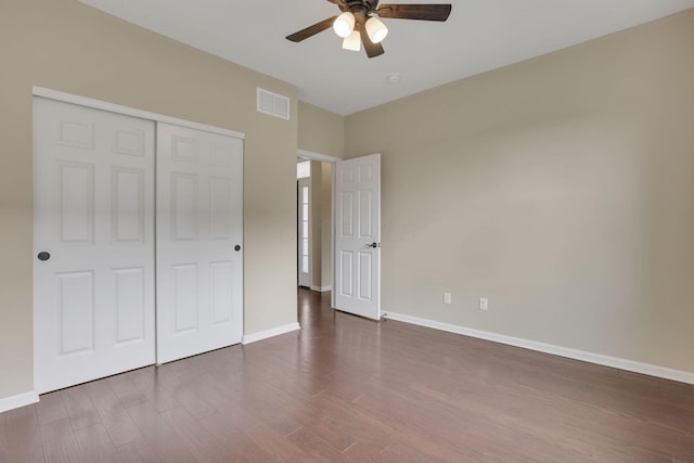 5351 Lilac Ave, Grove City, OH 43123 - unfurnished bedroom with dark wood-style floors, a closet, and ceiling fan