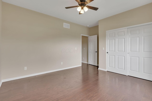 5351 Lilac Ave, Grove City, OH 43123 - unfurnished bedroom featuring wood finished floors, a closet, and a ceiling fan