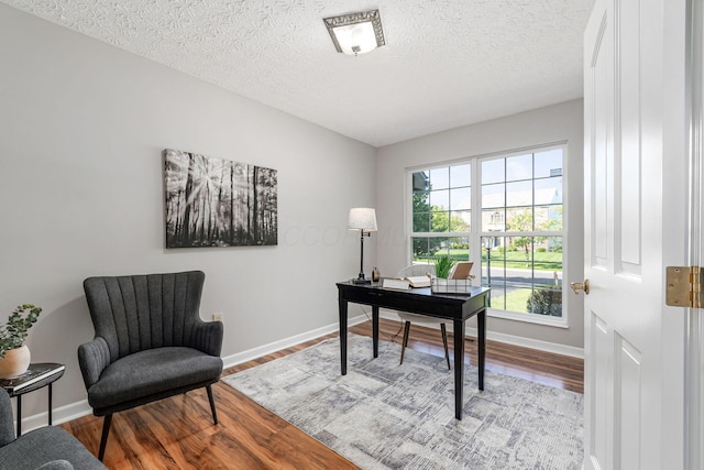 1148 Challis Springs Dr, New Albany, OH 43054 - home office with baseboards, wood finished floors, and a textured ceiling
