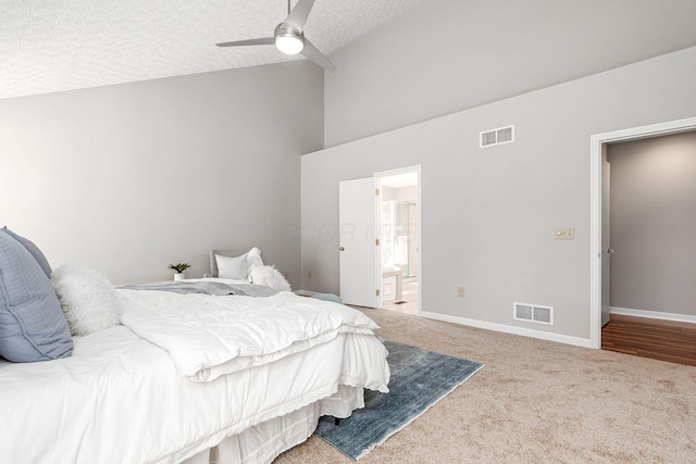 1148 Challis Springs Dr, New Albany, OH 43054 - bedroom with carpet floors, high vaulted ceiling, a textured ceiling, connected bathroom, and a ceiling fan