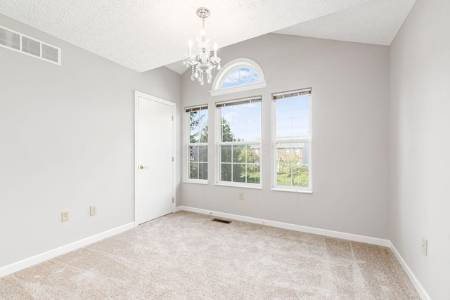 1148 Challis Springs Dr, New Albany, OH 43054 - carpeted empty room featuring a chandelier, lofted ceiling, a textured ceiling, and baseboards