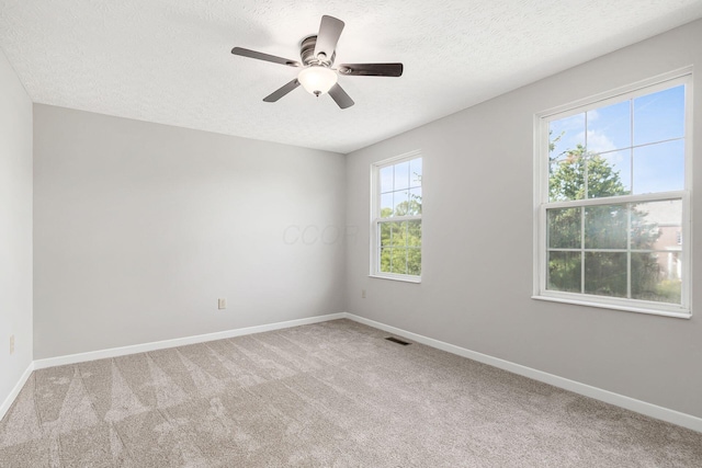 1148 Challis Springs Dr, New Albany, OH 43054 - carpeted empty room with a textured ceiling, baseboards, and a ceiling fan