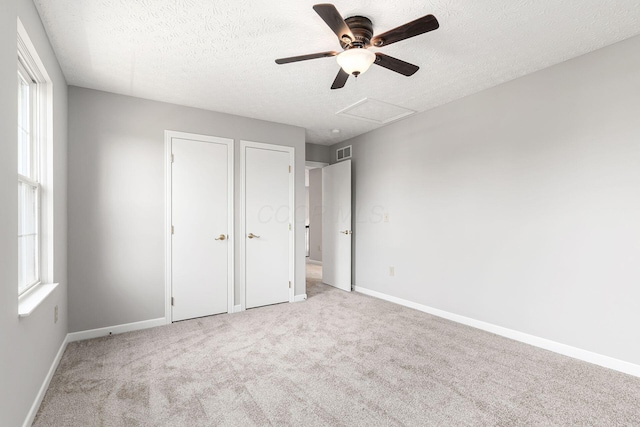 1148 Challis Springs Dr, New Albany, OH 43054 - unfurnished bedroom featuring carpet flooring, a textured ceiling, baseboards, and ceiling fan