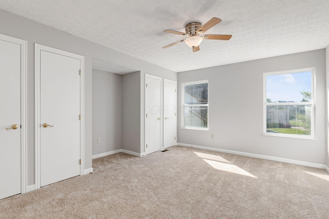 1148 Challis Springs Dr, New Albany, OH 43054 - unfurnished bedroom with carpet flooring, baseboards, a textured ceiling, and a ceiling fan