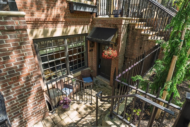 property entrance with brick siding