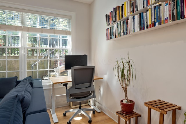 office area featuring baseboards and wood finished floors