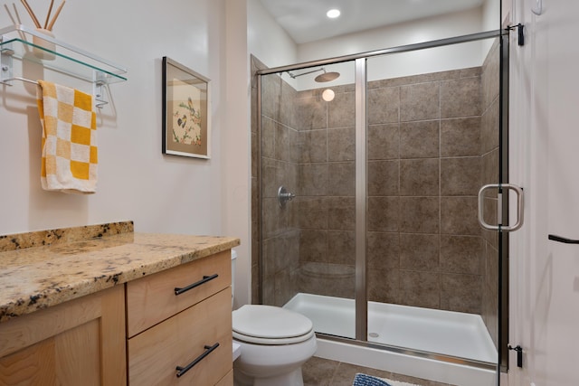 full bath with tile patterned flooring, a shower stall, and toilet