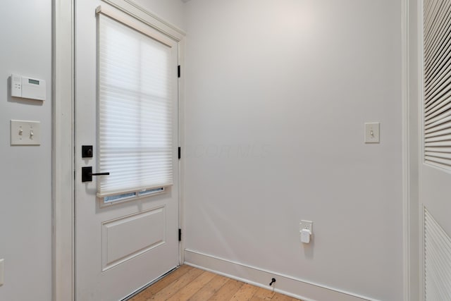 entryway with light wood finished floors