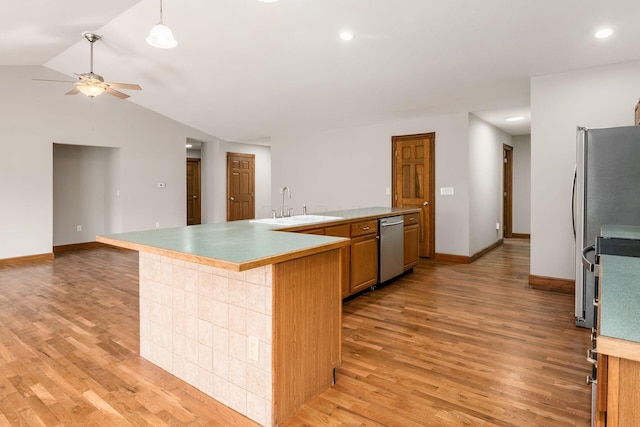277 Cherrington Rd, Westerville, OH 43081 - kitchen with a sink, appliances with stainless steel finishes, a ceiling fan, a peninsula, and light wood finished floors