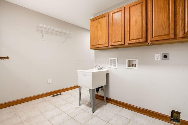 277 Cherrington Rd, Westerville, OH 43081 - clothes washing area featuring hookup for an electric dryer, baseboards, washer hookup, visible vents, and cabinet space