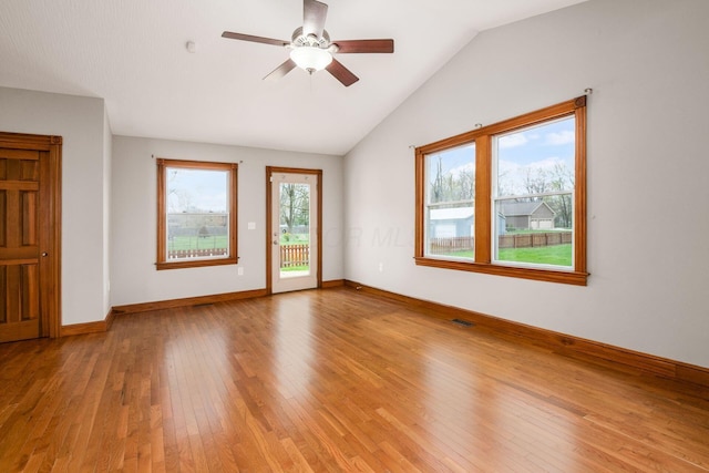 277 Cherrington Rd, Westerville, OH 43081 - empty room with visible vents, a wealth of natural light, hardwood / wood-style floors, and lofted ceiling