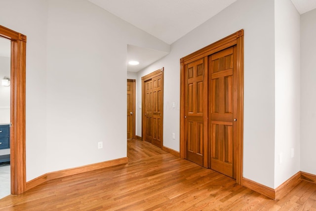 277 Cherrington Rd, Westerville, OH 43081 - hall with light wood finished floors, baseboards, and vaulted ceiling