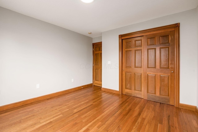 277 Cherrington Rd, Westerville, OH 43081 - unfurnished bedroom featuring a closet, light wood finished floors, and baseboards