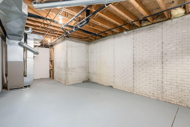 277 Cherrington Rd, Westerville, OH 43081 - unfinished below grade area featuring heating unit and brick wall